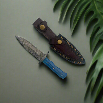 Knife with a blue handle and leather sheath on a white background